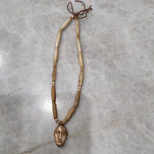 Beaded Necklace with Face Pendant